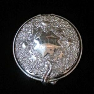 International Silver silverplated repoussé compact